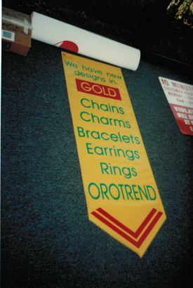 Penant style banner for a store front window. 